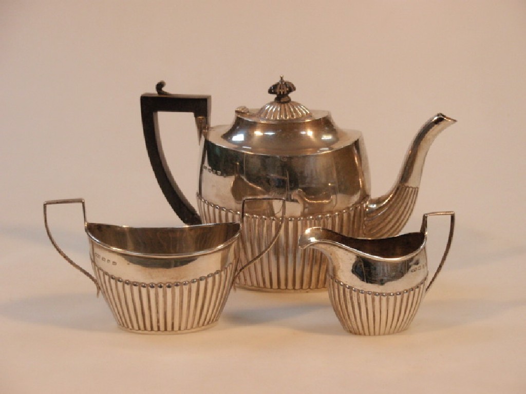 Appraisal: A late Victorian silver three piece tea service of boat