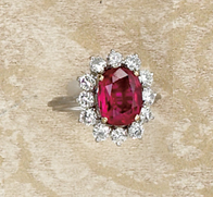 Appraisal: RUBY AND DIAMOND RING Platinum lady's ring centering one cushion