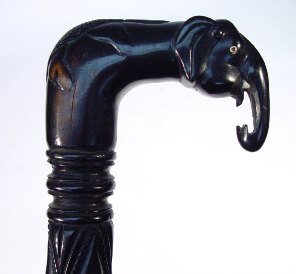 Appraisal: Ebony walking stick the handle carved with an elephant set