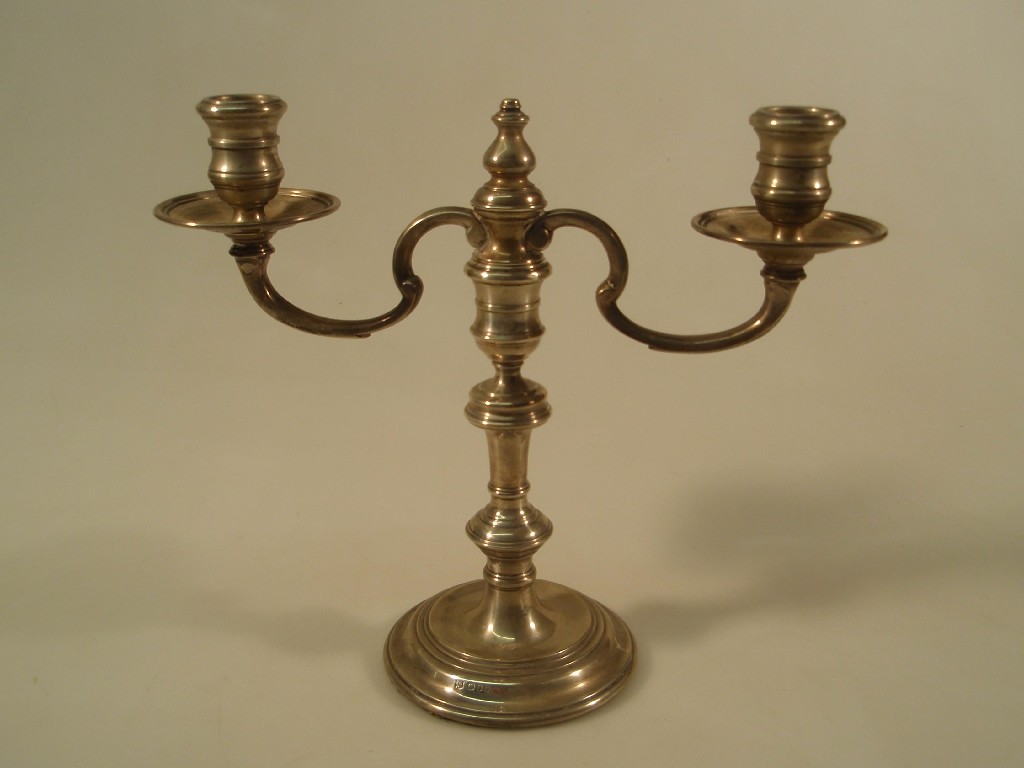 Appraisal: A mid thC silver two branch candelabra with fixed sconces