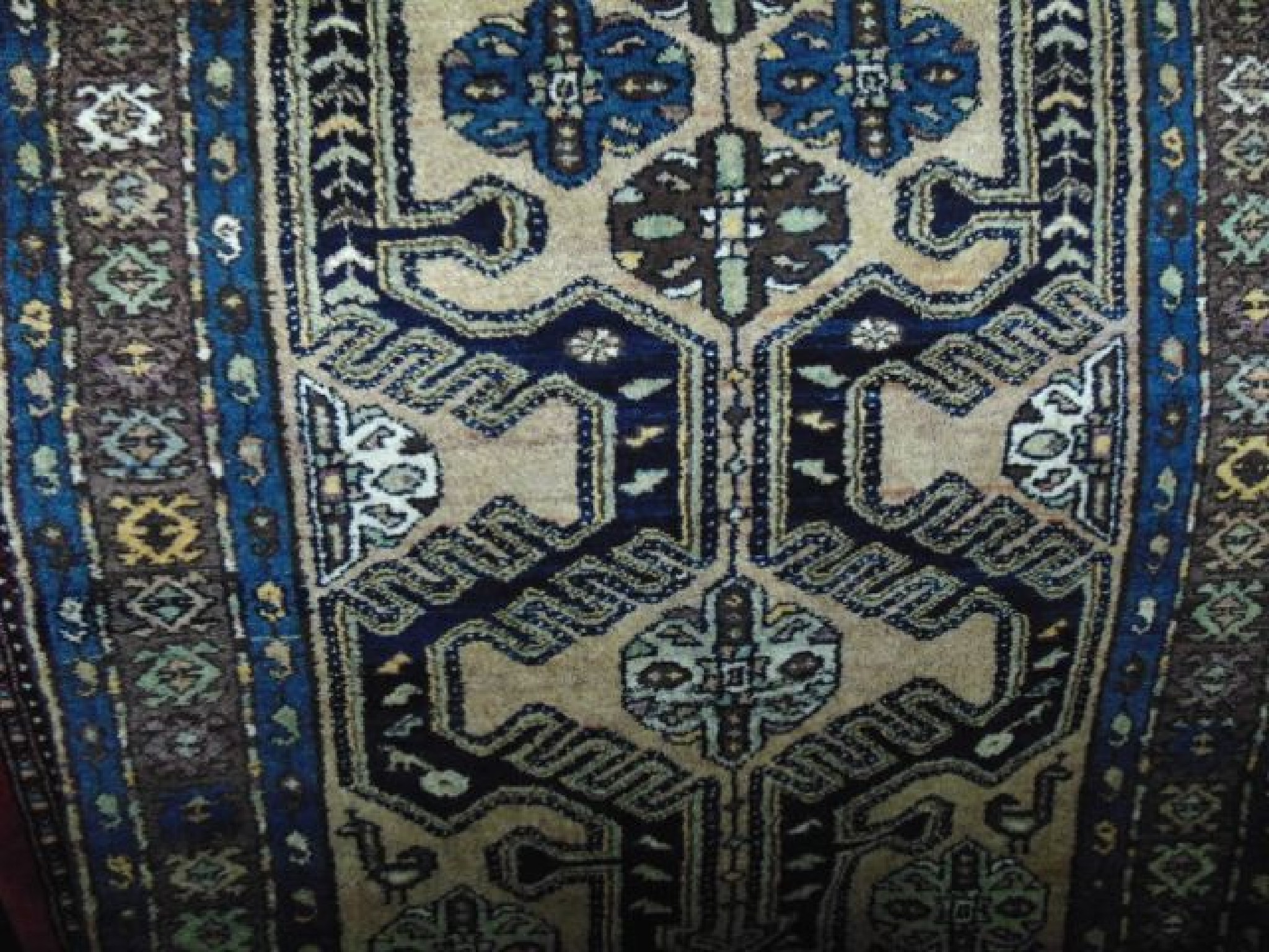 Appraisal: A Turkey wool carpet with multi medallion centre upon a