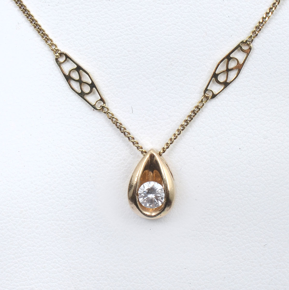 Appraisal: K CHANNEL SET DIAMOND NECKLACE Yellow gold pendant is perfectly