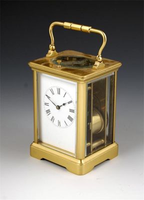 Appraisal: A French gilt brass corniche case repeating carriage clock with