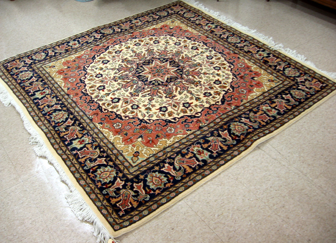 Appraisal: SQUARE ORIENTAL CARPET Indo-Persian hand knotted wool pile ' x