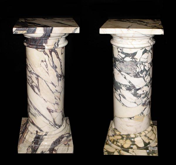 Appraisal: A pair of variegated marble pedestals restorations height in