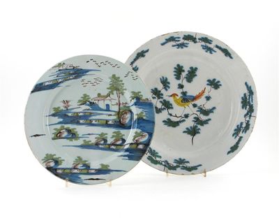 Appraisal: Two polychrome delftware dishes the larger painted with an exotic