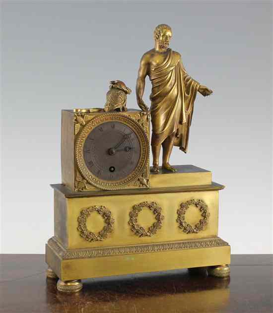 Appraisal: An Empire ormolu mantel timepiece surmounted with a figure of