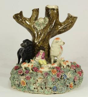 Appraisal: English Staffordshire figural group depicting a shepherd and sheep resting