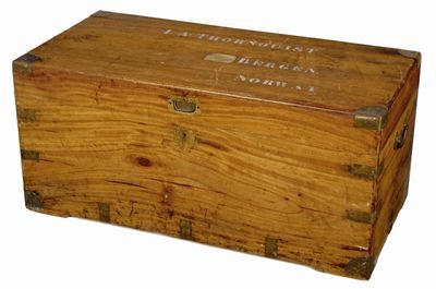 Appraisal: A camphorwood trunk brass bound with side carrying handles and