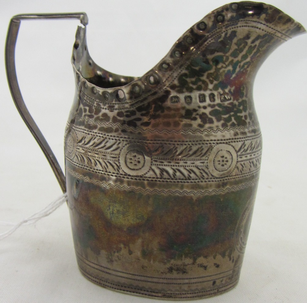 Appraisal: A George III silver cream jug decorated with a bright