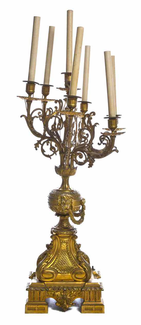 Appraisal: A Continental Gilt Bronze Seven-Light Candelabrum each baluster form standard