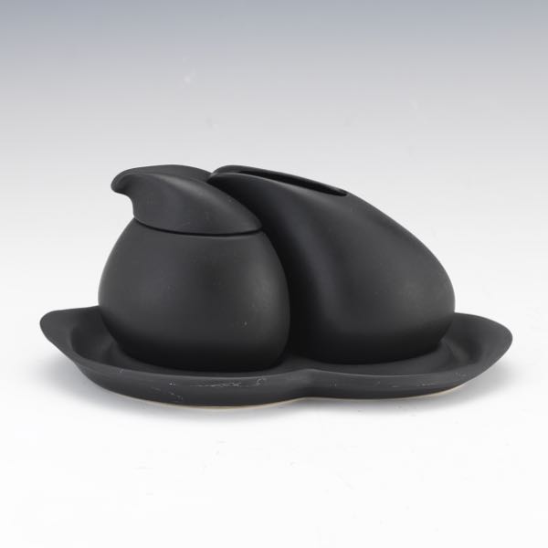 Appraisal: PETER SAENGER DESIGN MATTE BLACK CERAMIC CREAMER AND SUGAR ON