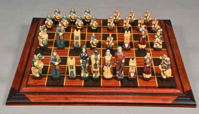 Appraisal: CELTIC CHESS SETFinely detailed Celtic composite multicolored medieval chess pieces