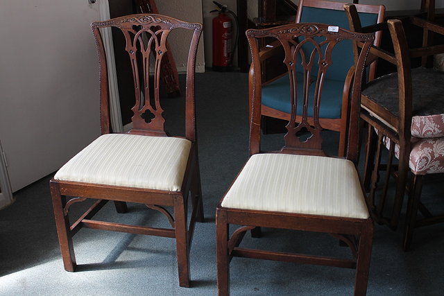 Appraisal: A PAIR OF GEORGE III MAHOGANY SPLAT BACK ARMCHAIRS with