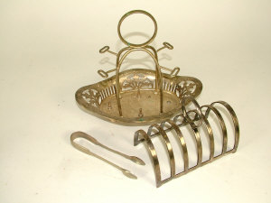 Appraisal: A plated cruet stand a five division toast-rack and a