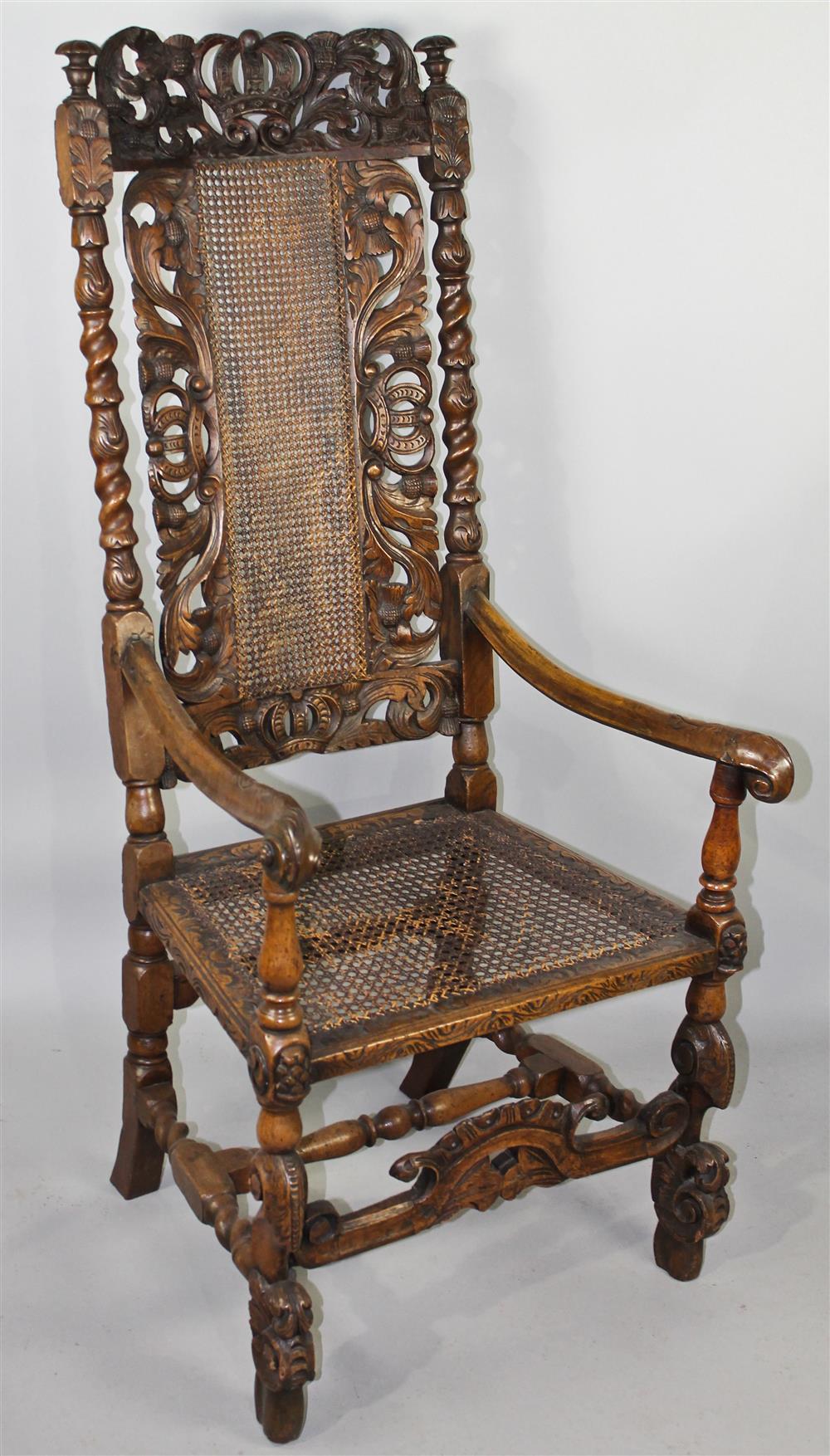 Appraisal: FLEMISH BAROQUE CARVED AND CANED ARMCHAIR having a heavily carved