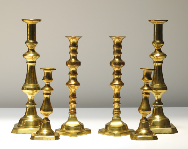 Appraisal: THREE PAIR BRASS CANDLESTICKS pieces all having squared bases from