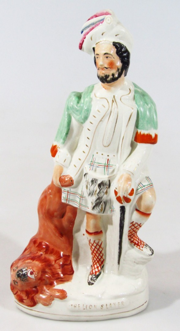 Appraisal: A late thC Staffordshire figure of the lion slayer standing