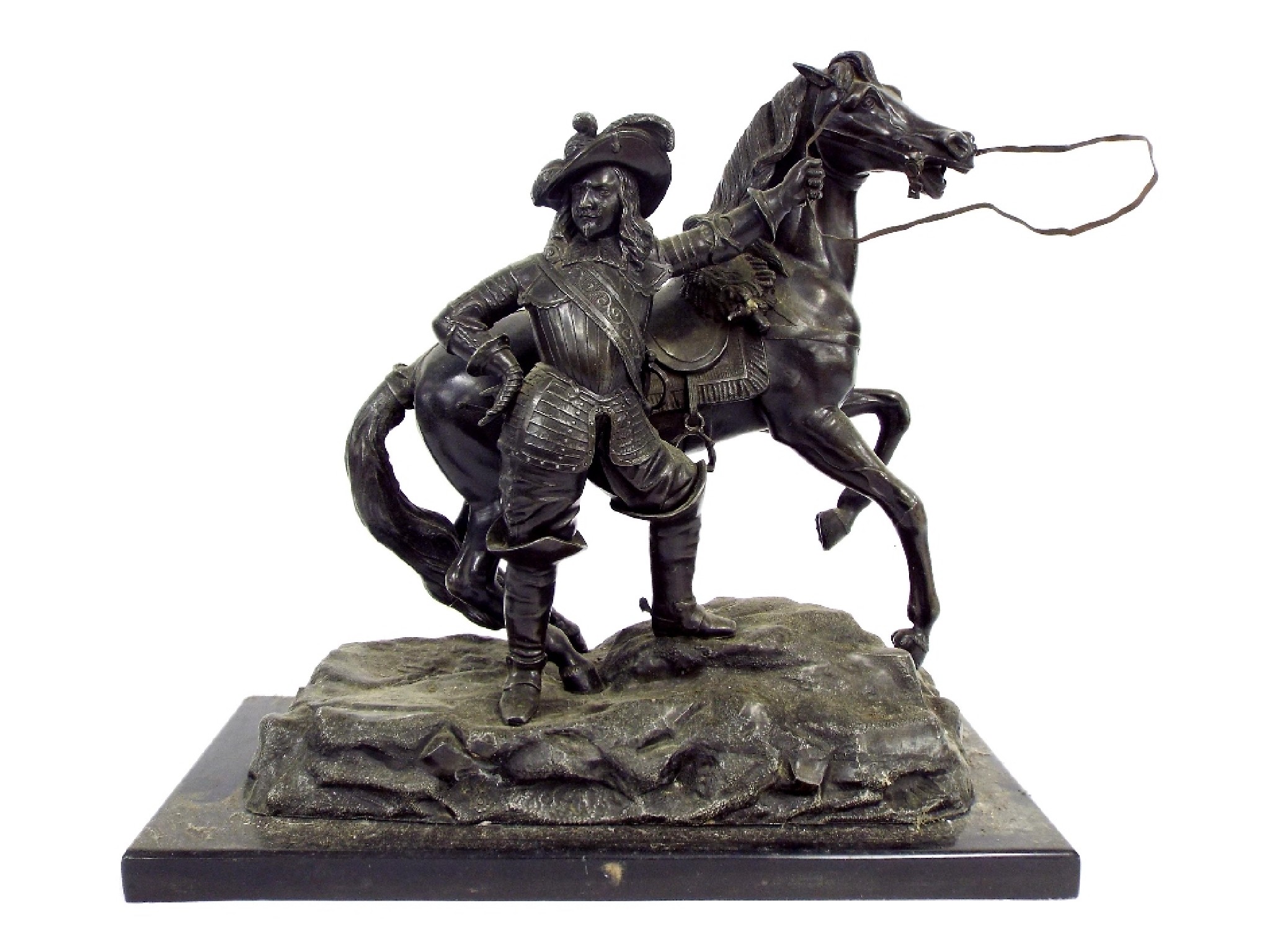 Appraisal: French patinated spelter figure of a soldier and charging horse