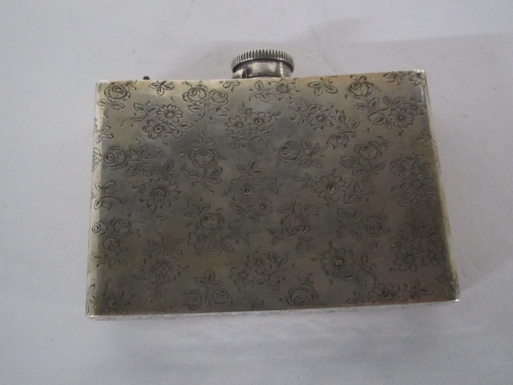 Appraisal: Continental silver spirit flask cigarette case with engraved floral decoration