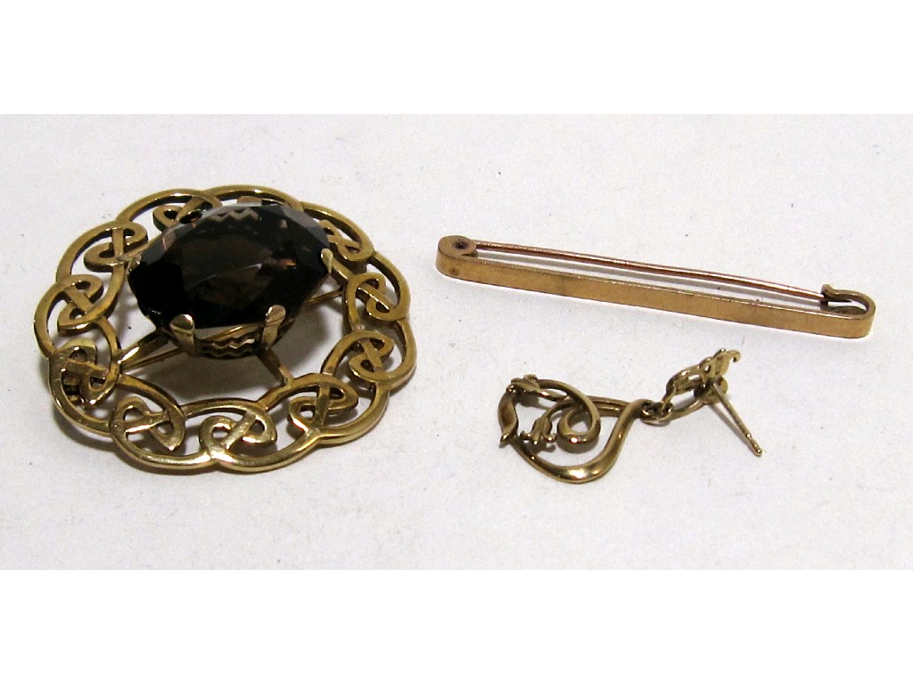 Appraisal: Lot comprising smokey topaz brooch in ct gold Celtic knot