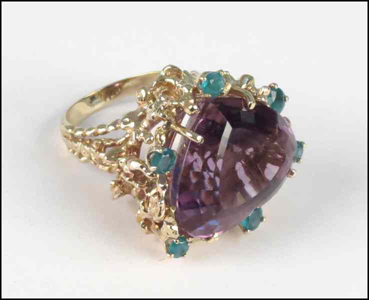 Appraisal: KARAT YELLOW GOLD AMETHYST AND EMERALD COCKTAIL RING Heart shaped