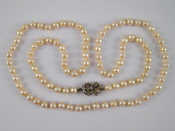 Appraisal: A cultured pearl necklace with a diamond set white gold