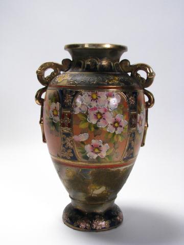 Appraisal: Japanese earthenware handled urn circa mid th century marked ''made