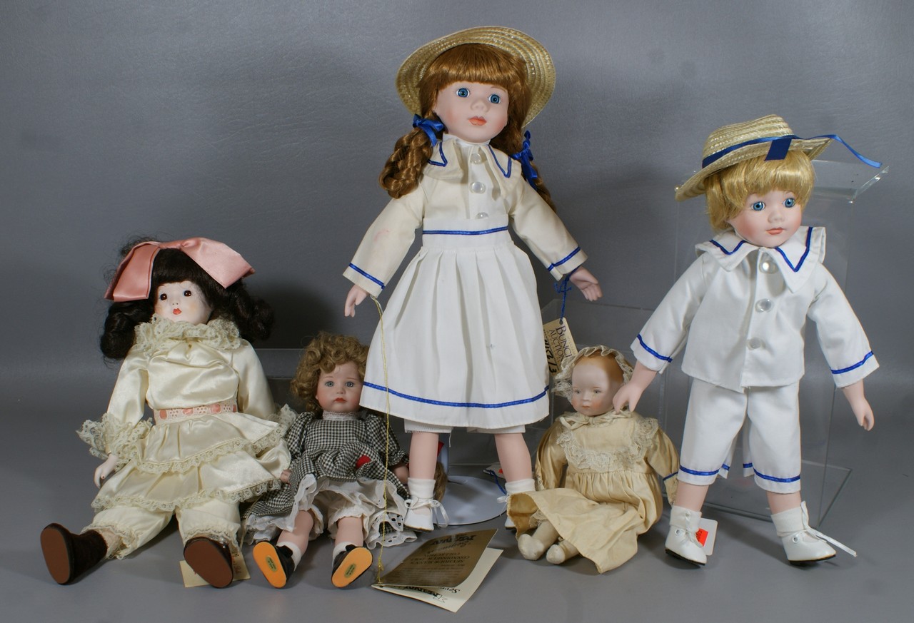 Appraisal: Porcelain dolls including pair of Seymour Mann boy girl dolls