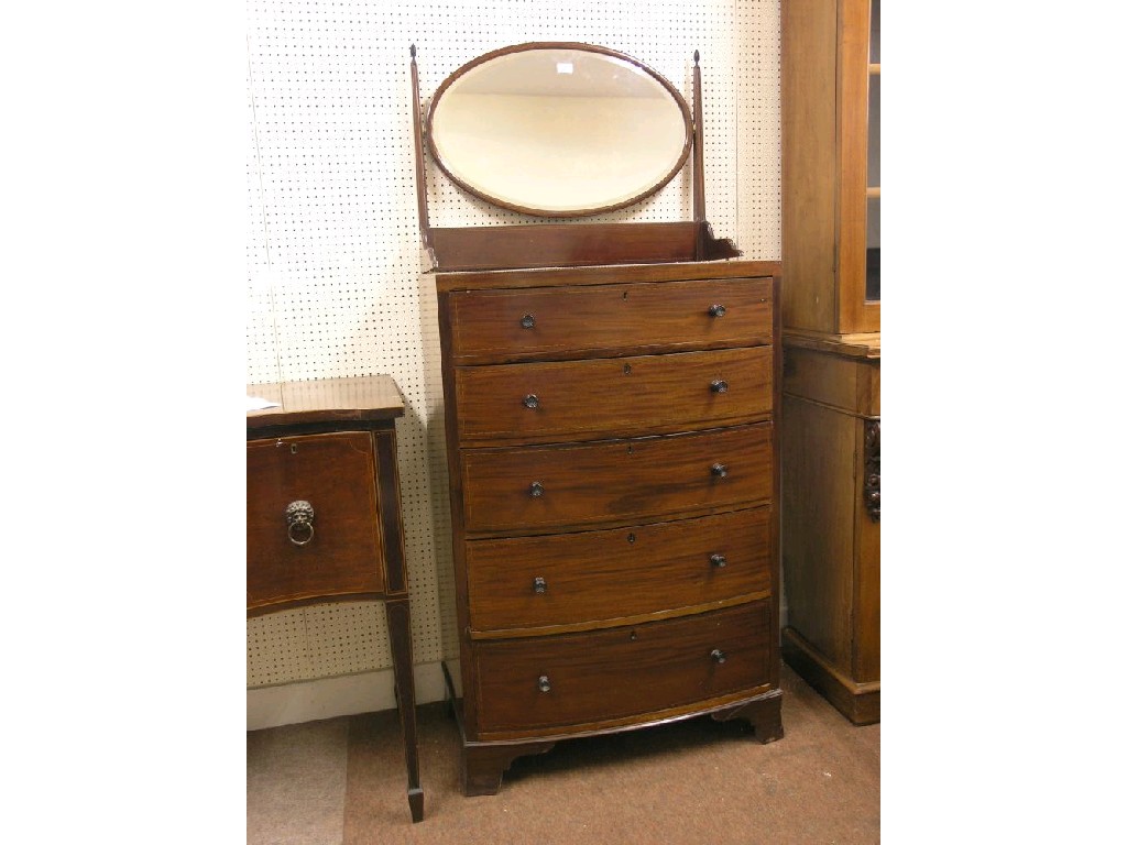 Appraisal: An early th century inlaid bow fronted mahogany bedroom chest