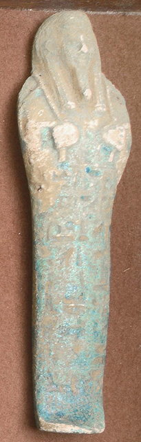 Appraisal: AN ANCIENT EGYPTIAN TURQUOISE GLAZED MOULDED POTTERY USHABTI the figure