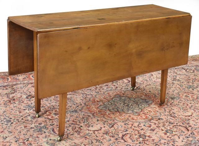 Appraisal: American Pembroke table th c with drop leaves rising on