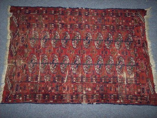 Appraisal: A Bokhara rug the red ground field with twenty elephant