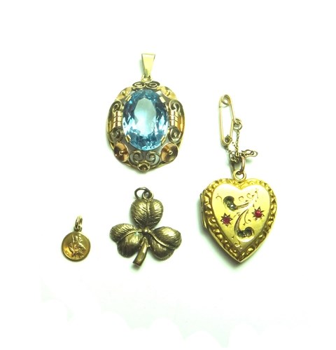 Appraisal: A gold mounted pale blue gem set oval pendant decorated