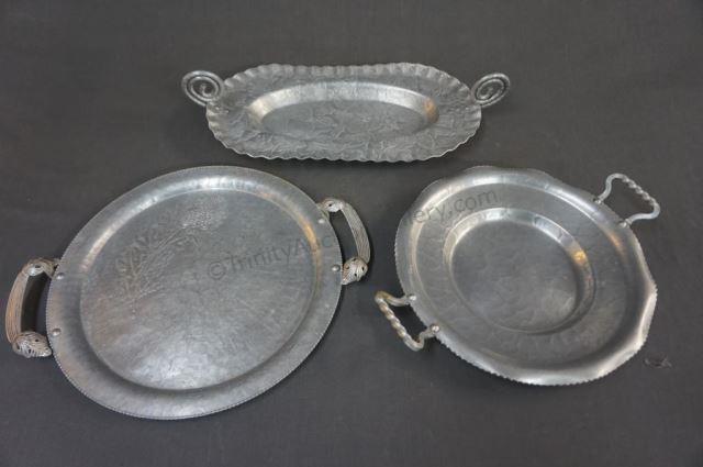 Appraisal: Hand Wrought Aluminum Serving Trays Three decorative handled serving trays