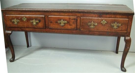 Appraisal: Early th century oak dresser with three drawers on cabriole