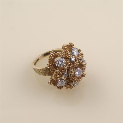 Appraisal: A diamond set gold cocktail ring c the textured abstract