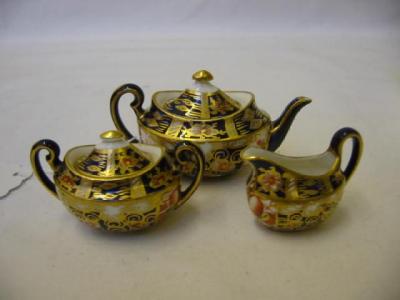 Appraisal: A ROYAL CROWN DERBY MINIATURE THREE PIECE TEA SET of