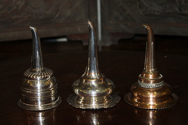 Appraisal: THREE TH CENTURY SHEFFIELD PLATED WINE FUNNELS