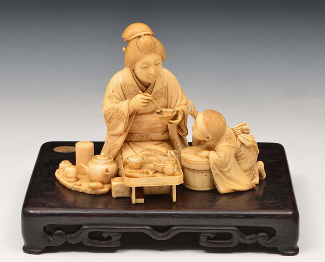 Appraisal: A Japanese ivory okimono of a mother and sonMeiji periodsigned