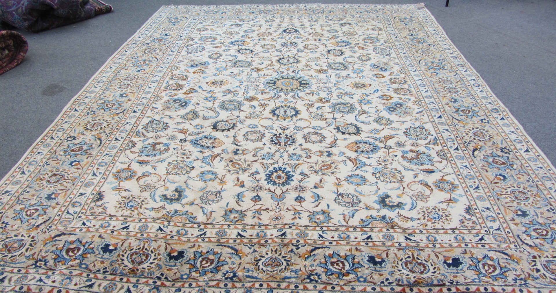 Appraisal: A Kashan carpet Persian the beige floral vine field with