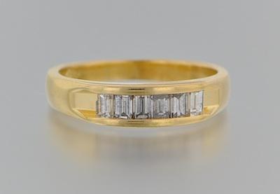 Appraisal: An k Gold and Diamond Ring k yellow gold ring