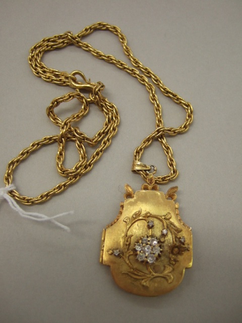 Appraisal: A diamond set pendant locket the front mounted with a