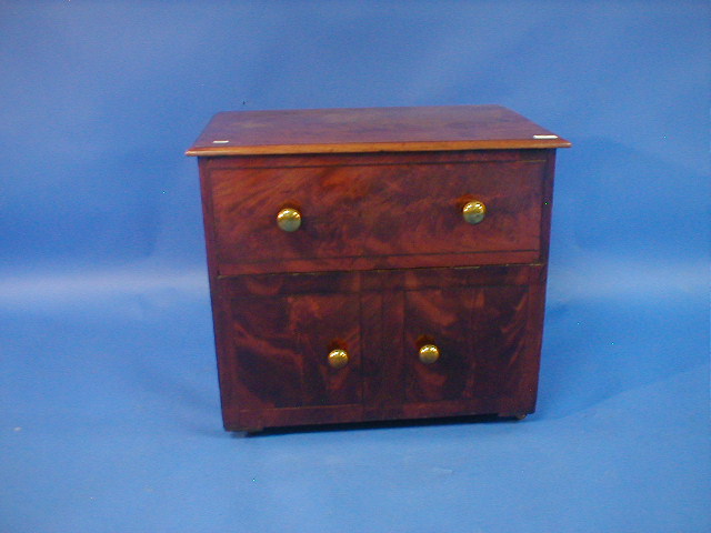 Appraisal: A thC flamed mahogany commode