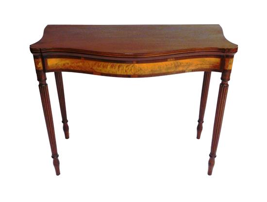 Appraisal: Card table with serpentine top c butterflied tiger maple apron