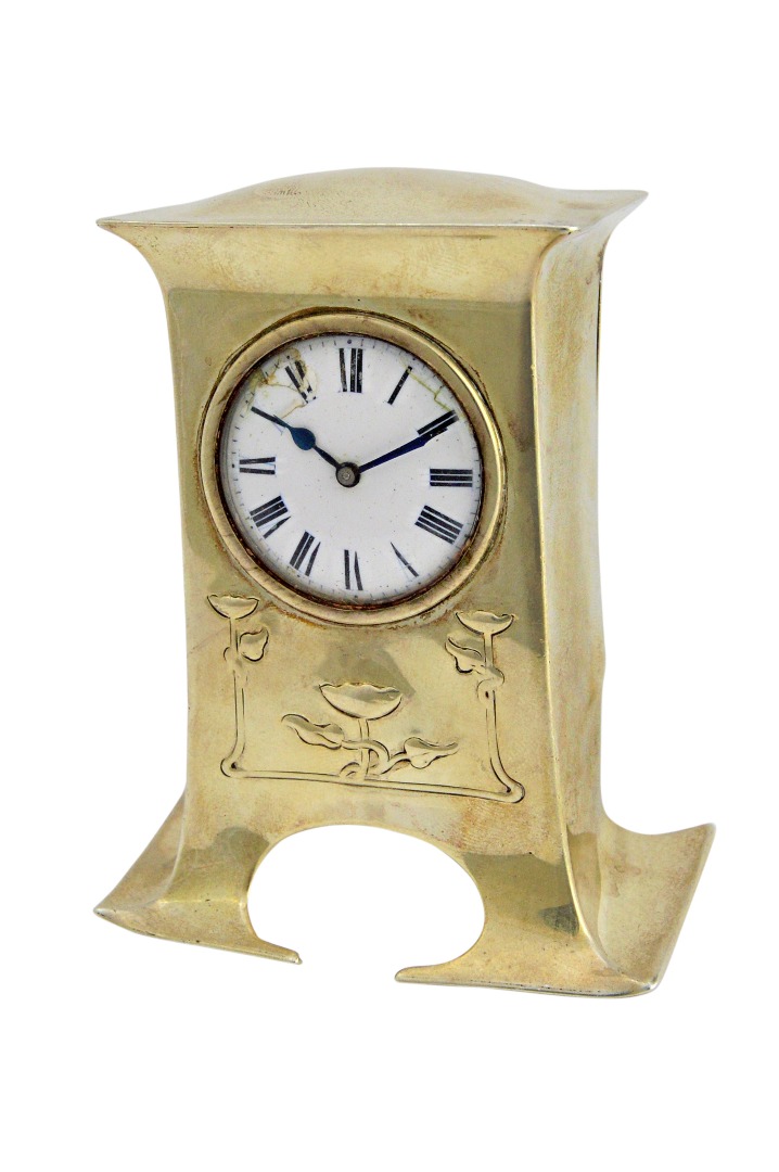 Appraisal: A silver shaped rectangular cased miniature timepiece clock with a