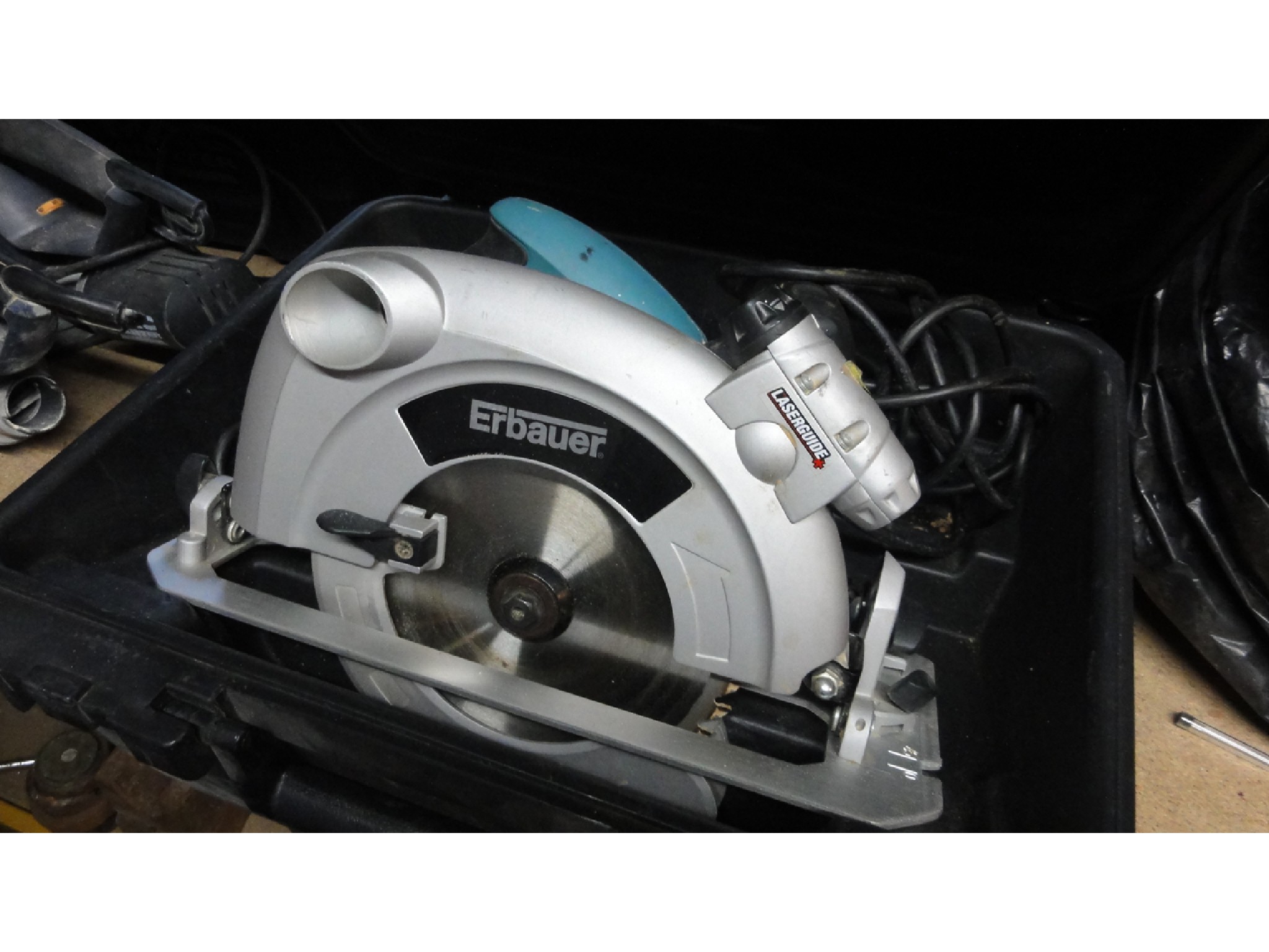 Appraisal: A cased Erbauer laser guided mm electric powered circular saw