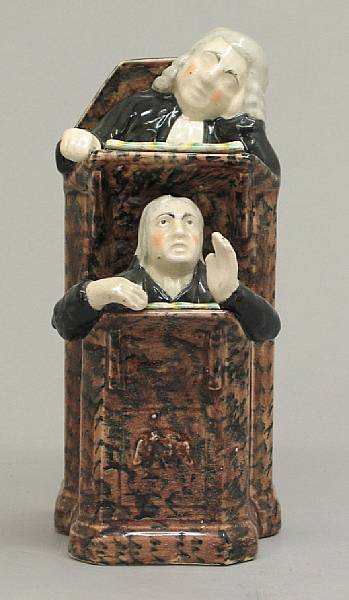 Appraisal: A Staffordshire pottery pulpit group of the Vicar and Moses