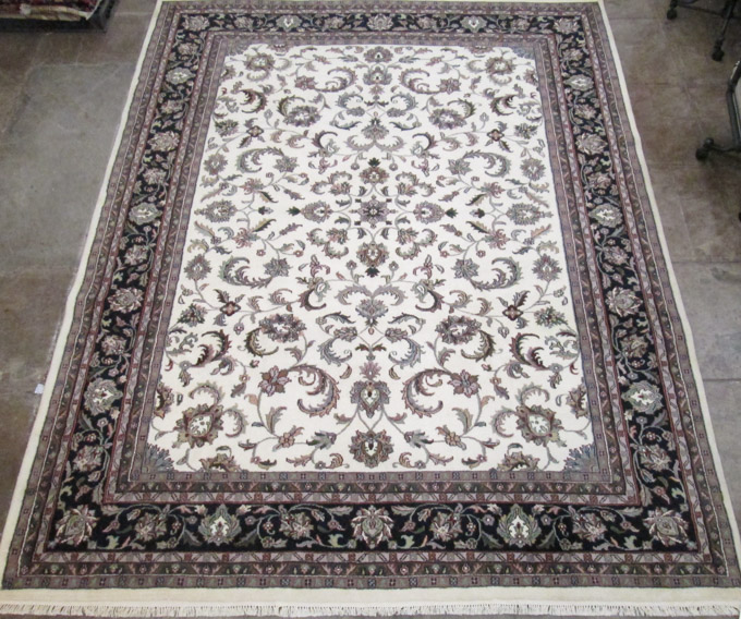 Appraisal: HAND KNOTTED ORIENTAL CARPET Indo-Persian overall floral design on cream