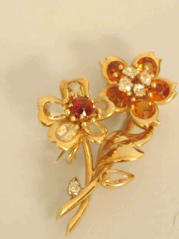 Appraisal: A Diamond and Citrine Flower Spray Clip the four circular-cut